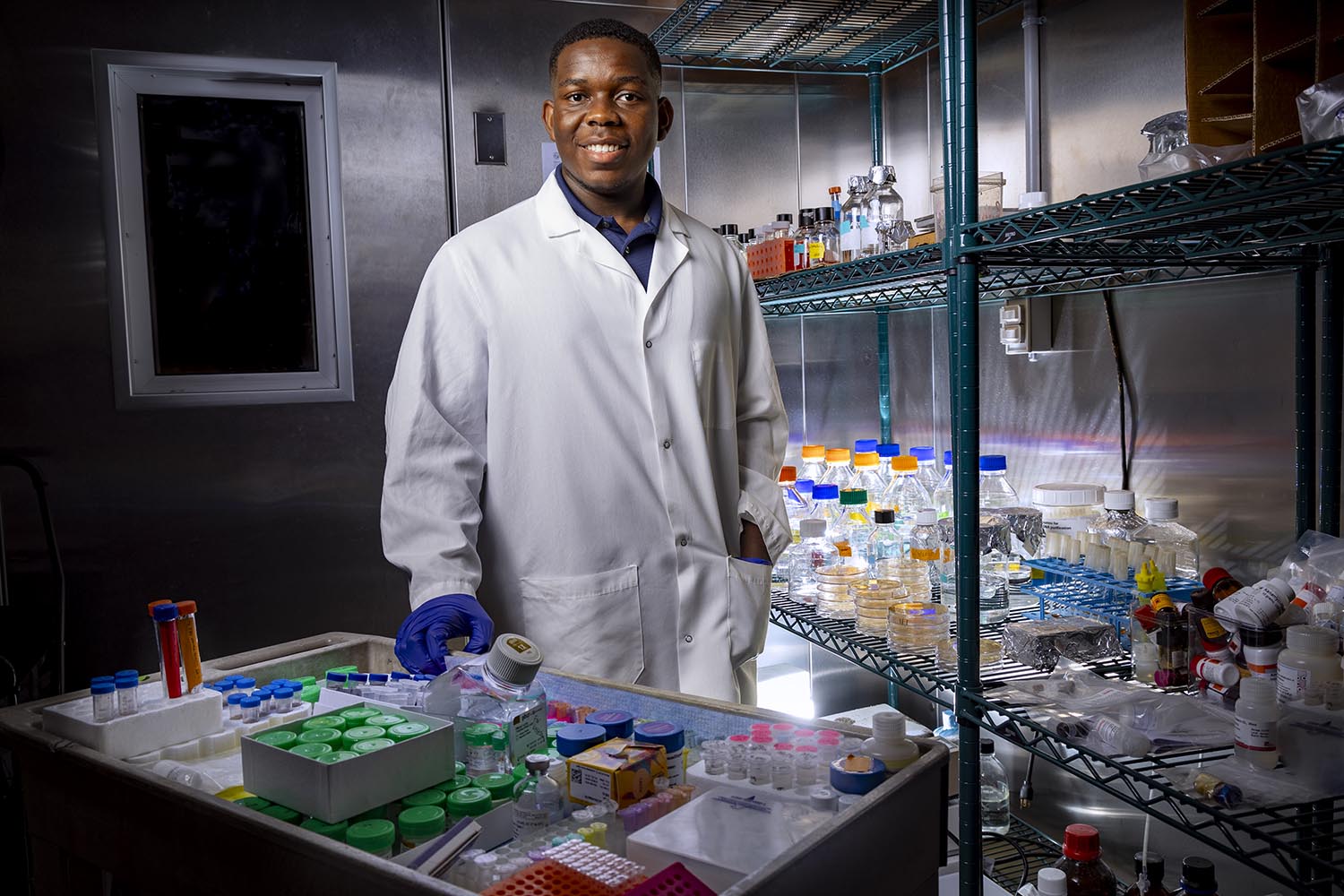 Jerald Whitley Jr. standing in the cold room of a lab.