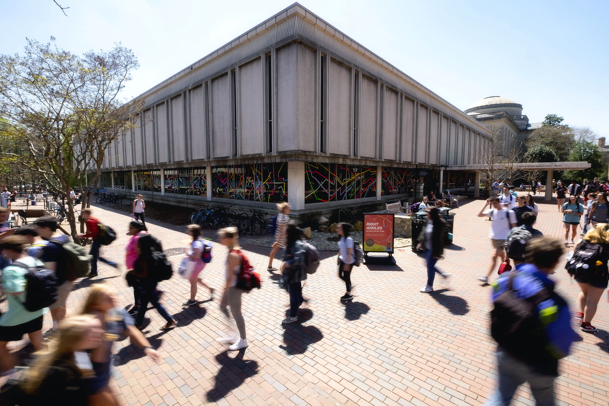 students head to class on UNC's campus