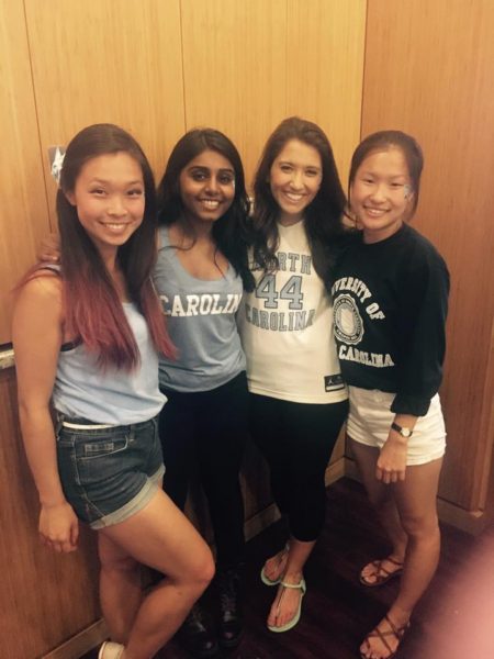 Bongu (second from left) and friends cheer on the Carolina basketball team at the Top of the Hill Restaurant watch party last year.