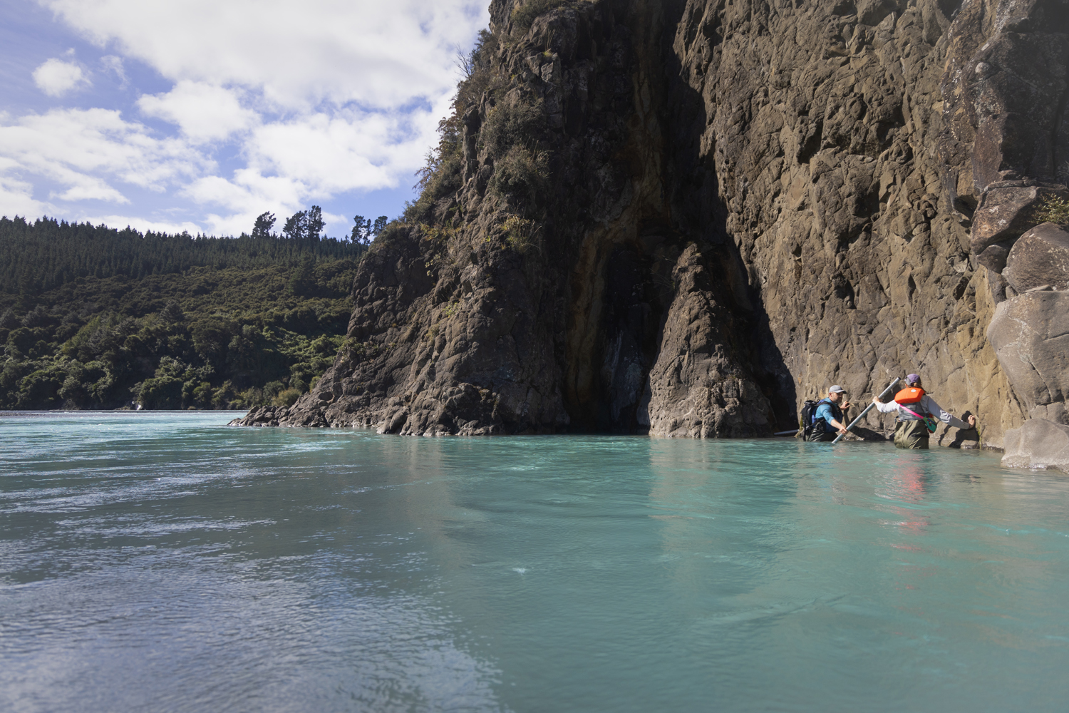 Tamlin Pavelsky and Camryn Kluetmeier navigate a field site on the river