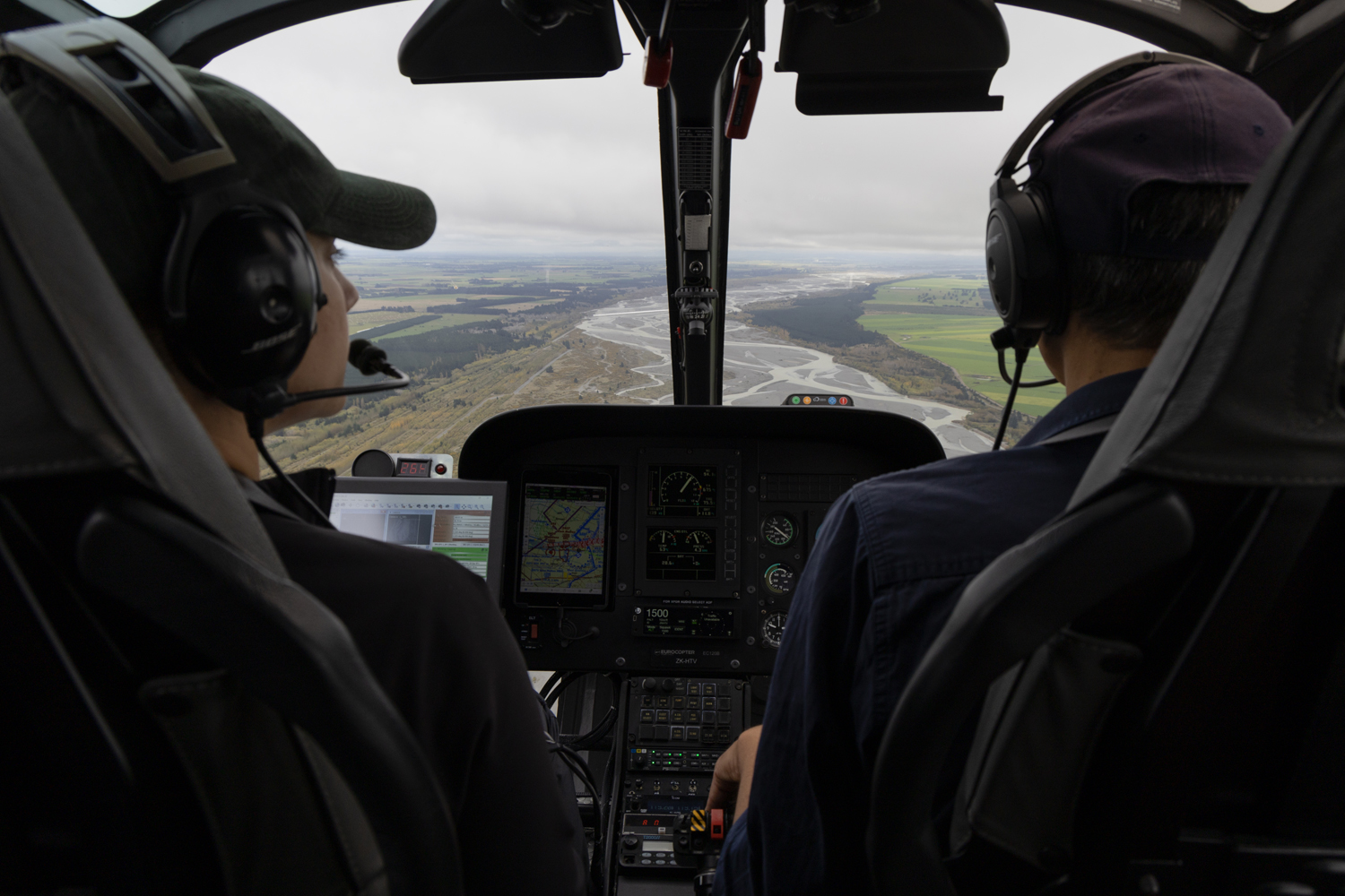 Marissa Dudek and a pilot in a helicopter