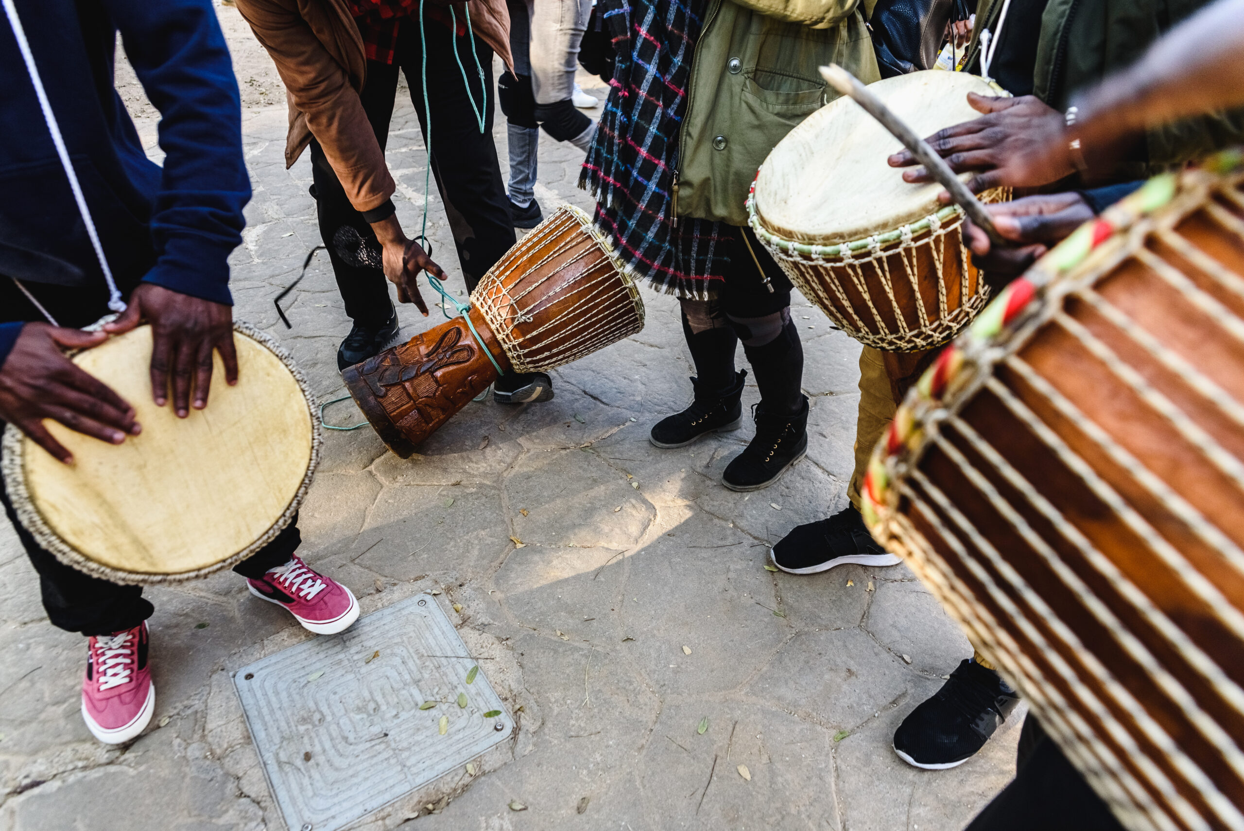 African drummers blowing their bongos on the street.
