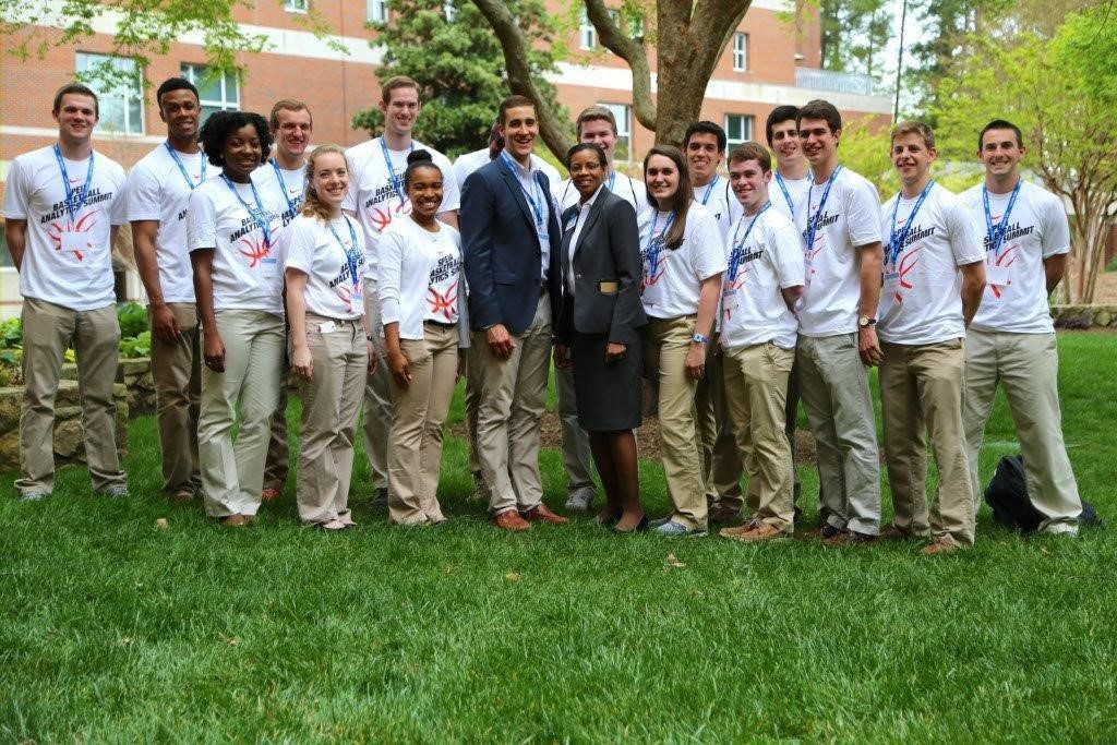 Deborah Stroman, a professor at the UNC Kenan-Flagler Business School, and Bryce Parrish, a second-year MBA student, stand front and center with the rest of the 2015 Basketball Analytics Summit team.