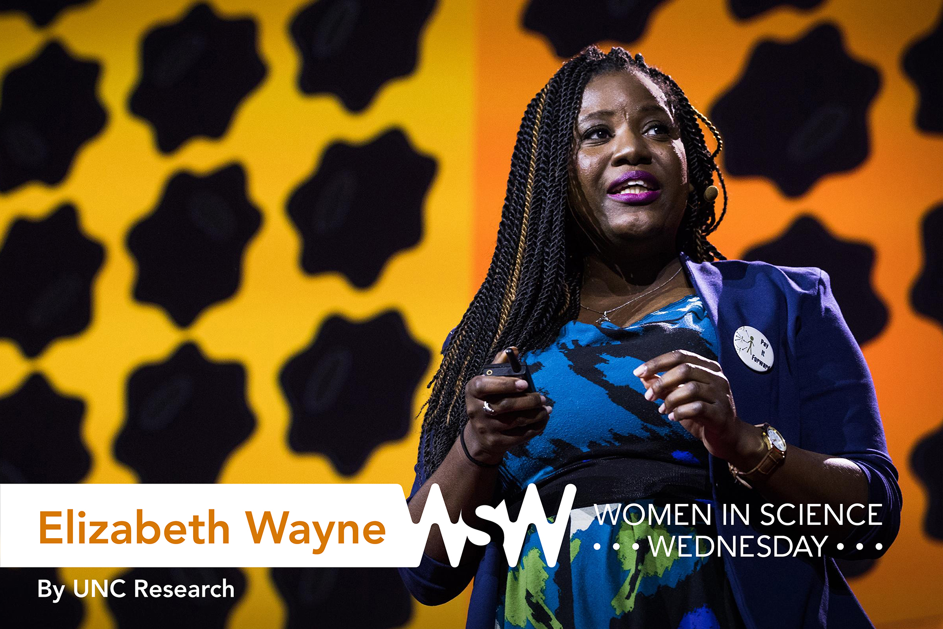 an African-American woman presents on stage at a TED Talk in Texas