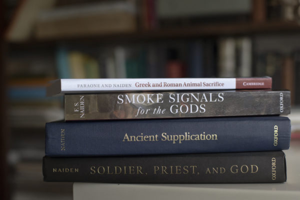 Four of Fred Naiden's books, which include "Greek and Roman Animal Sacrifice," "Smoke Signals for the Gods," "Ancient Supplication," and "Soldier, Priest, and God"