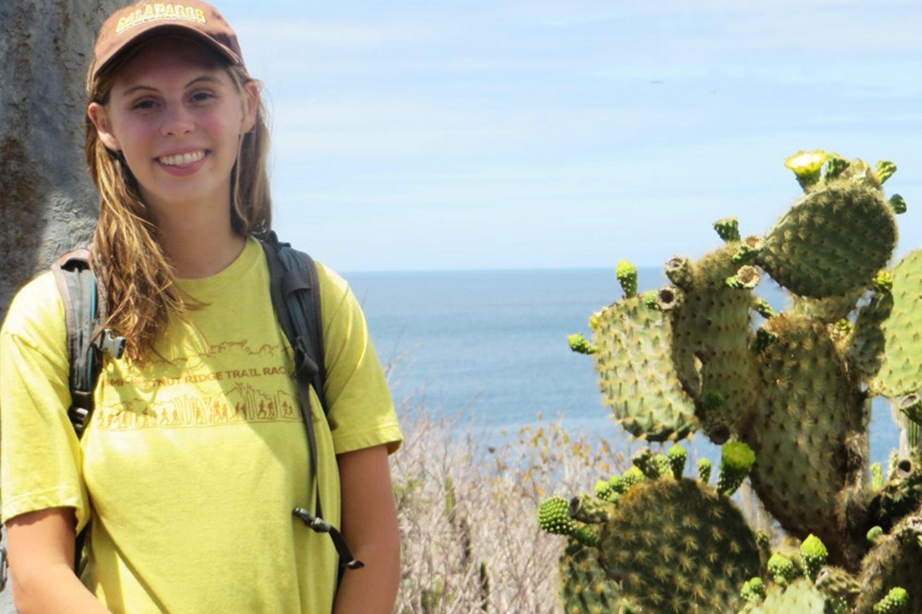 Haley Moser in the Galapagos, the ocean is behind her