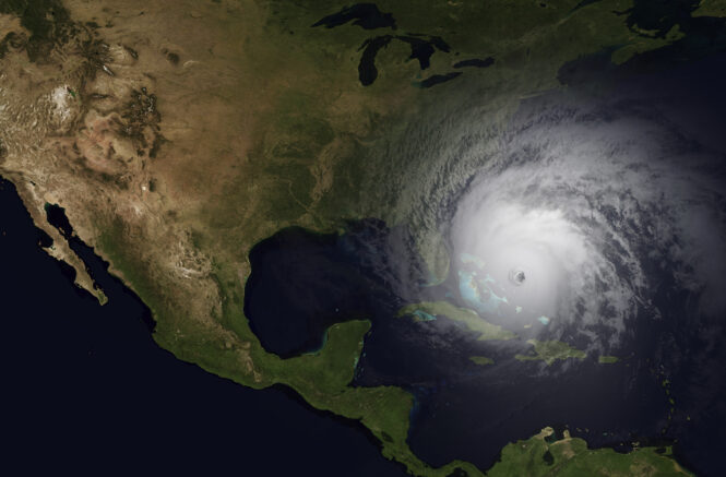 A bird's eye view of the United States, with a hurricane moving over the Caribbean toward the eastern U.S.