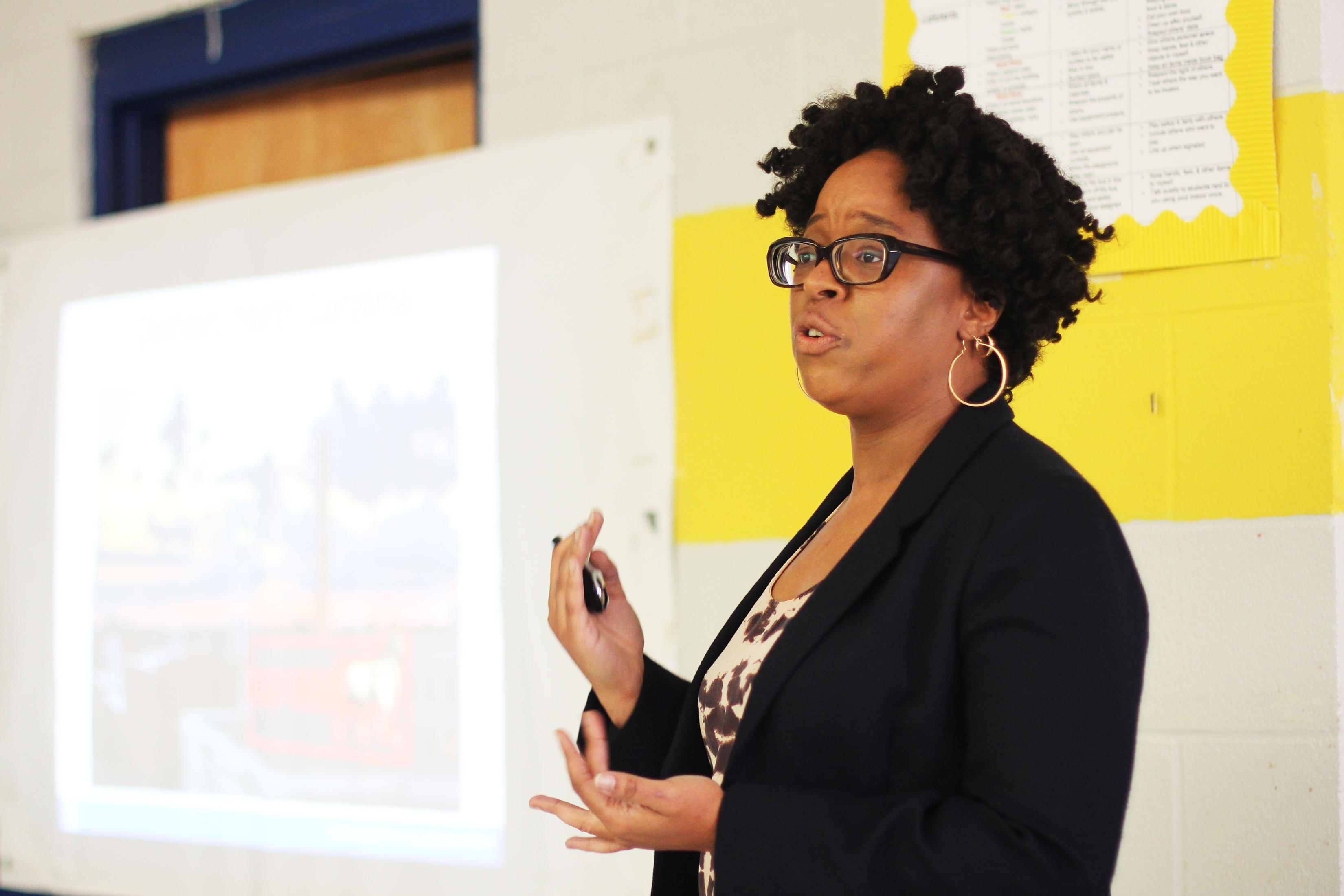 Danielle Spurlock giving a speech at town hall meeting.