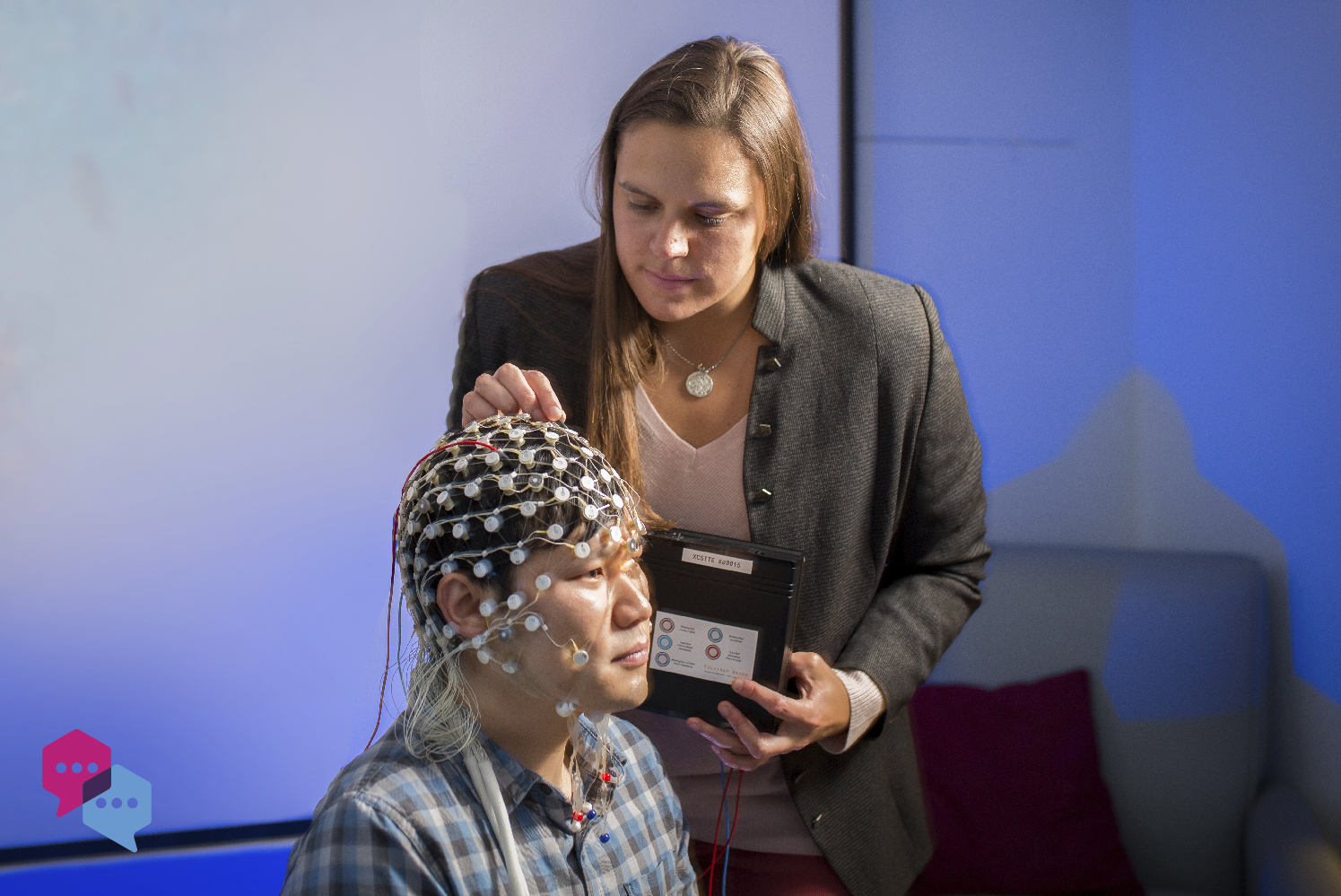 Julianna Prim places nodes on a patient's head