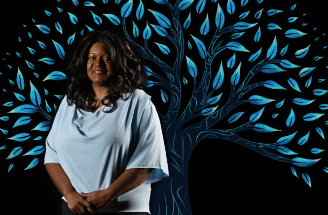 Ramona Denby-Brinson with an illustrated tree behind her