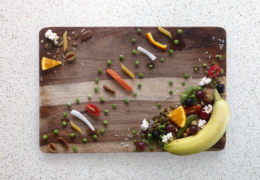 a cutting board with a DNA strand made out of food