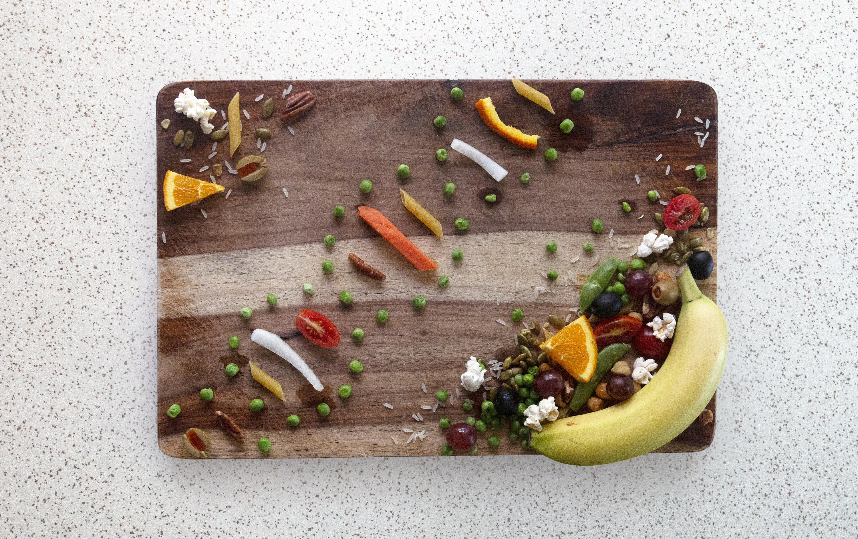 a cutting board with a DNA strand made out of food