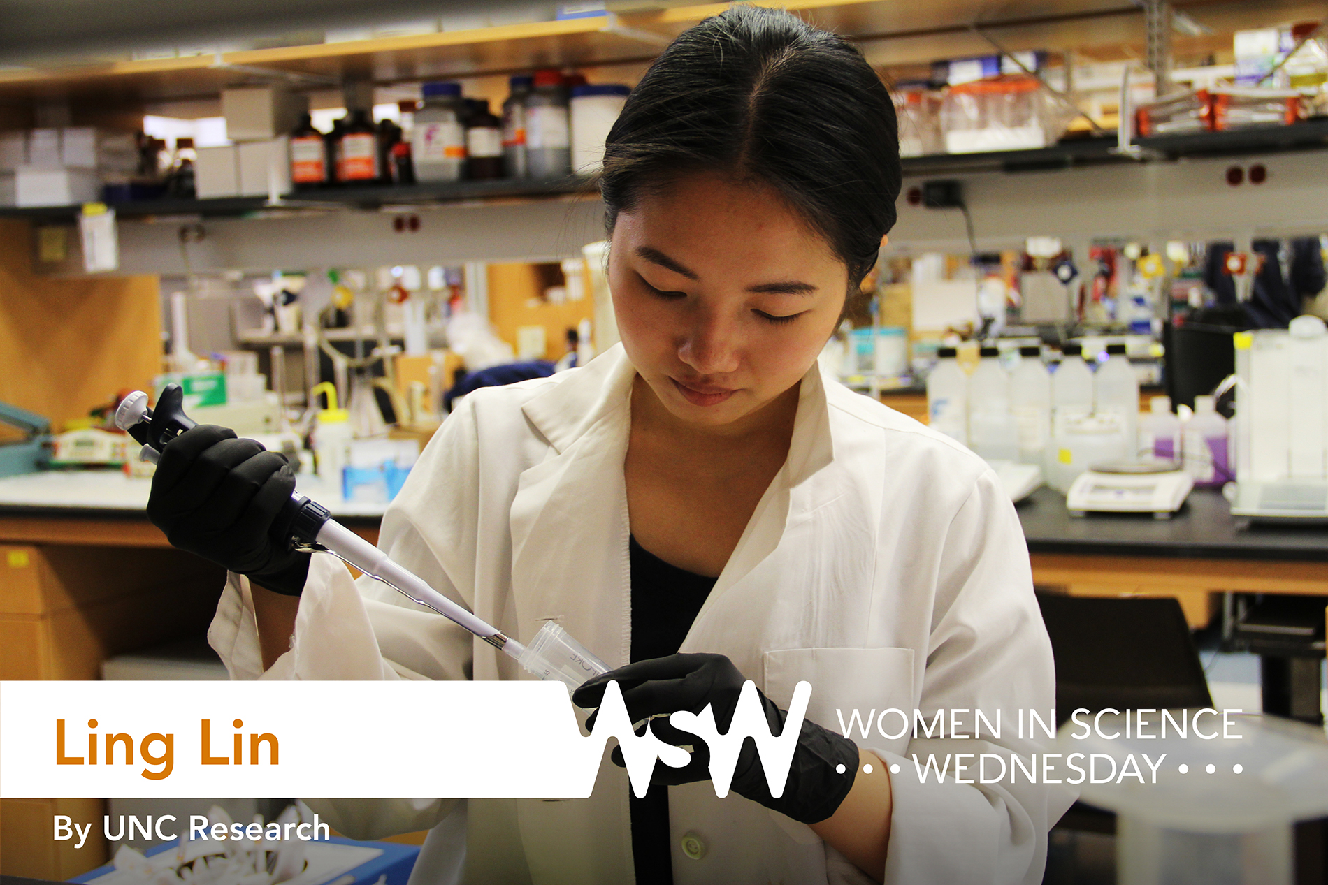 a young Chinese girl in a lab coat pipettes fluid into a vial