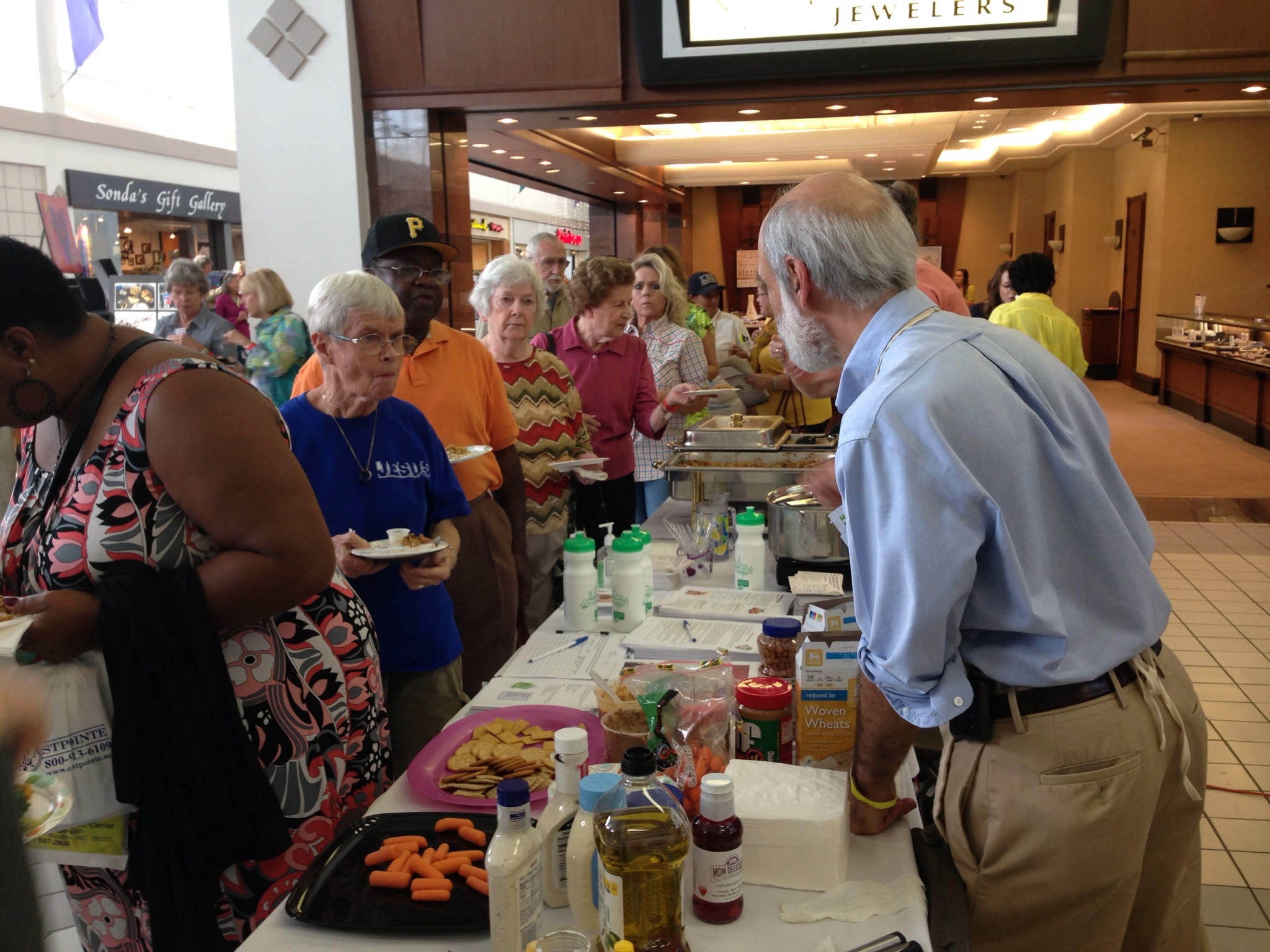 Tom Keyserling talks to attendees at the "Living the Good Life Expo" event.