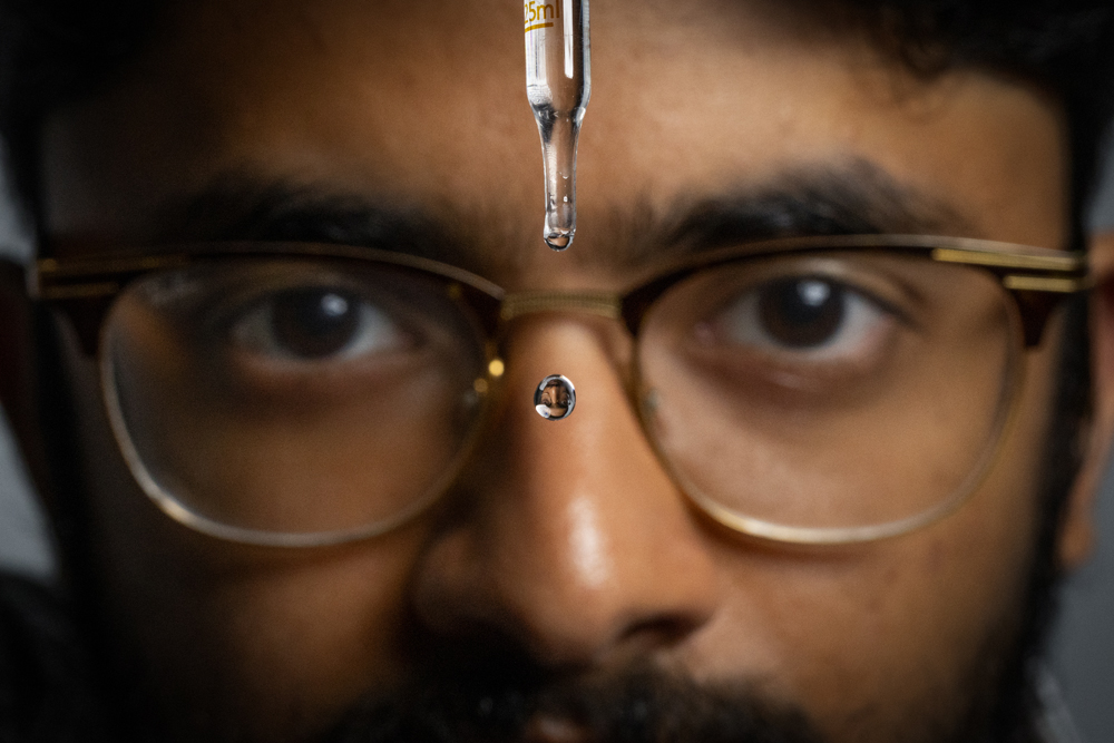 Abel Abraham uses a dropper to create a water droplet