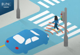 graphic of a woman crossing a crosswalk and an autonomous vehicle "sensing" her as she walks past