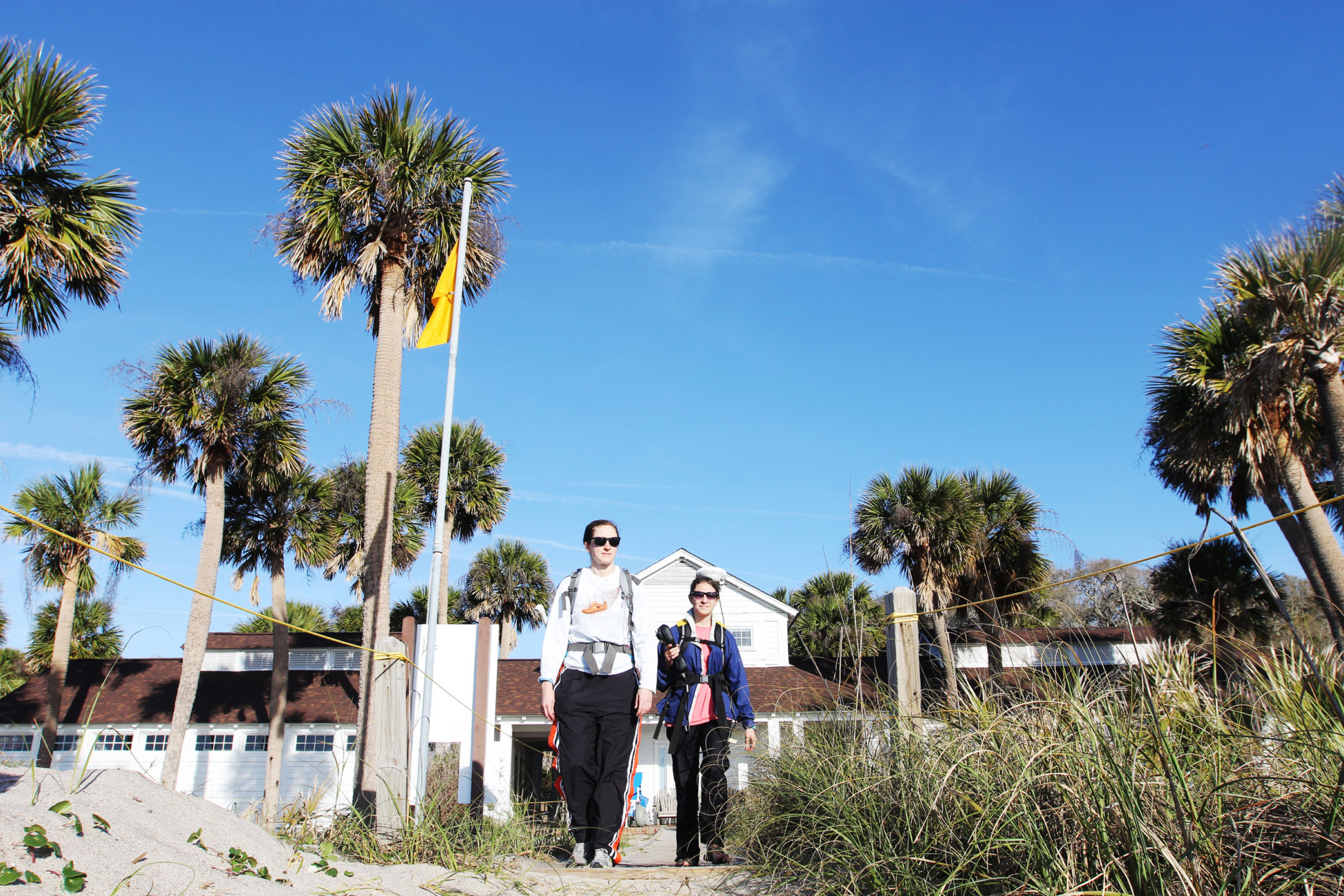 Elsemarie deVries and Anna Atencio make their way to the beach