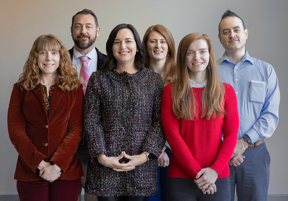 Group photo of the Endeavors staff against a gray background. Front (left to right): Alyssa LaFaro, Layla Dowdy, Corina Prassos. Rear (left to right): Andrew Russell, Carleigh Gabryel, Darren Abrecht.
