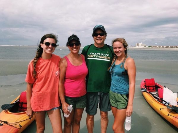 Ashley Ward (second from left) with her two daughters and husband