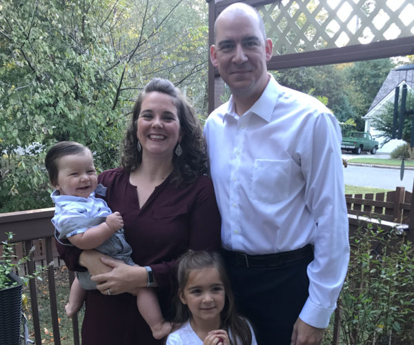 family of four -- mom and dad with their baby son and yound daughter