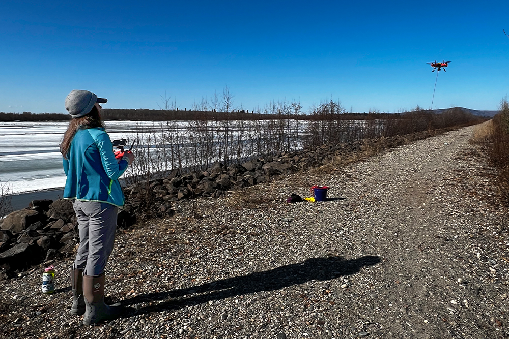 Julianne Davis flying a drone