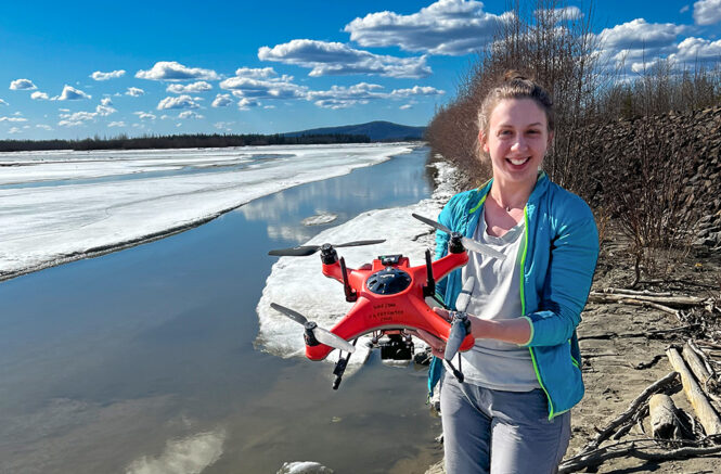 Julianne Davis holds a drone in Alaska