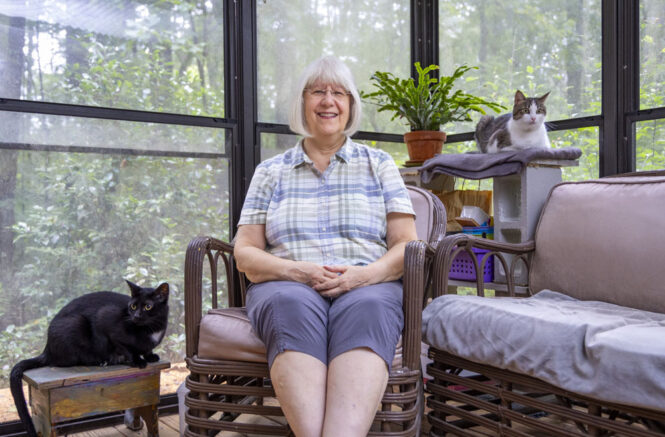 Patricia Sawin with her two cats