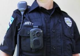 Detailed image of a cop wearing a body cam.