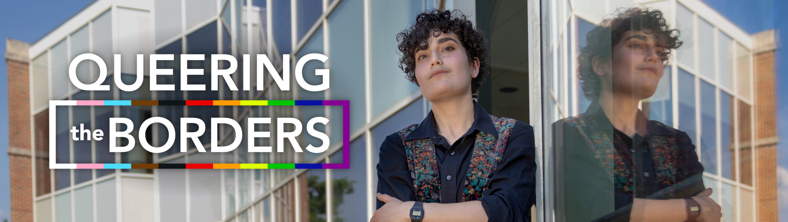 Main feature banner for a story called "Queering the Borders" Image shows Suad Jabr, a UNC PhD student in the geography department studying the media's portrayal of LGBTQIA+ refugees fleeing the Middle East. Click the banner for more information.
