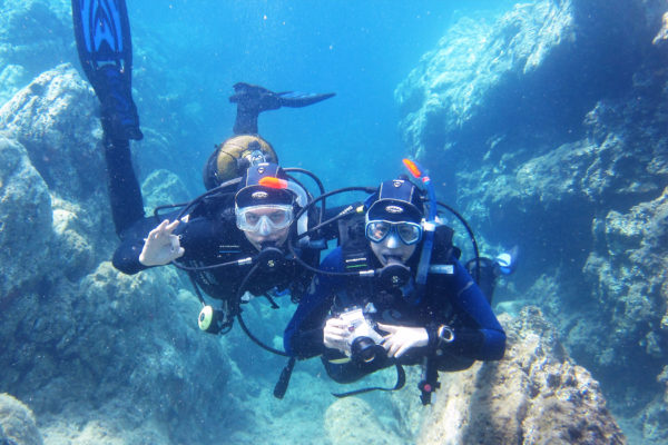 two scuba divers underwater